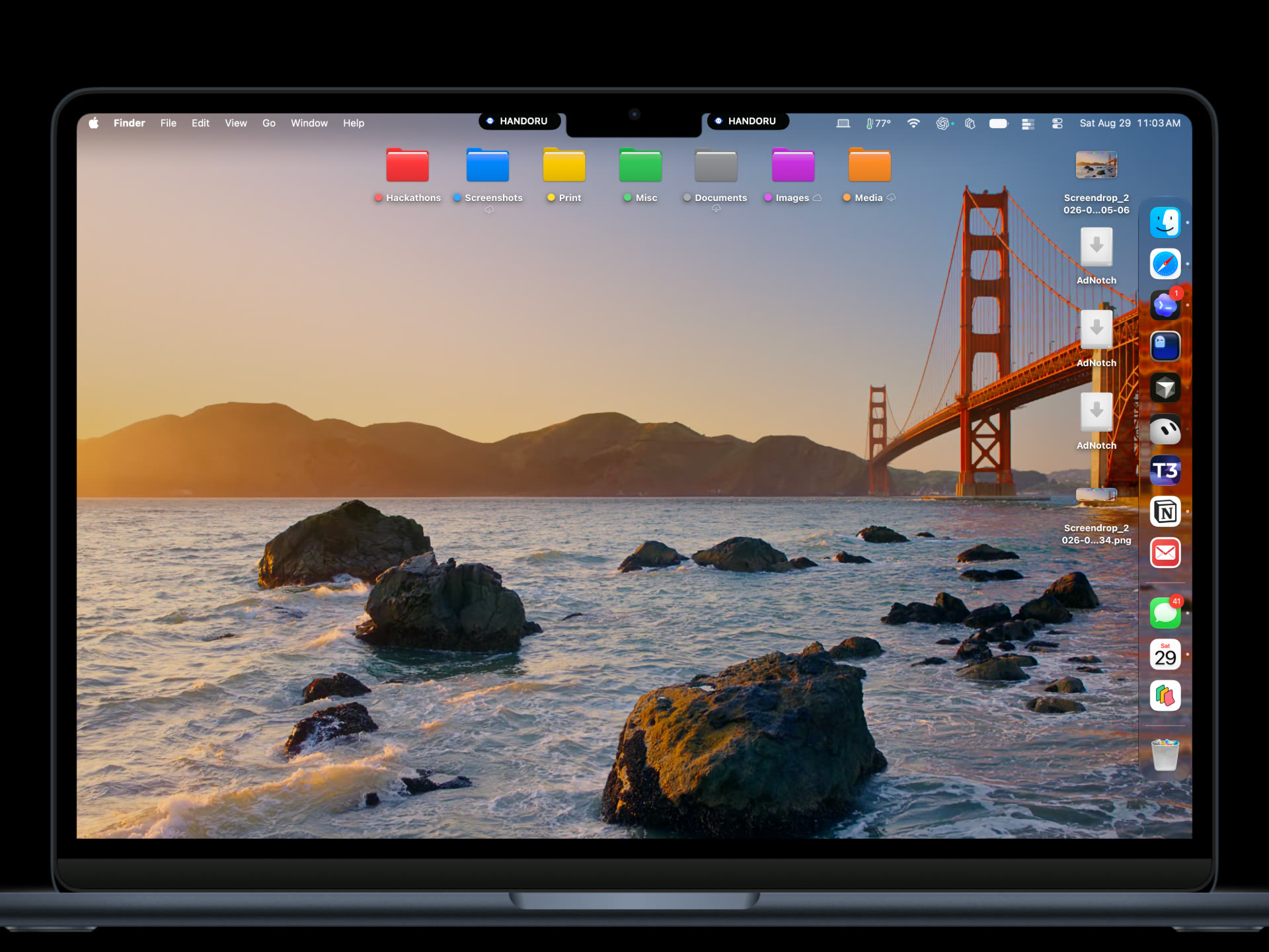 Ad Notch running two HANDORU placements beside a MacBook camera notch.